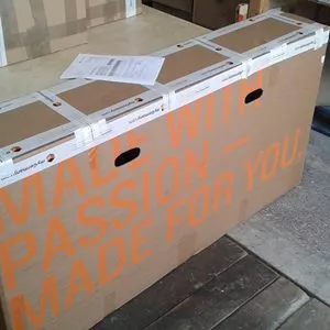 large cardboard shipping box labeled “made with passion – made for you”